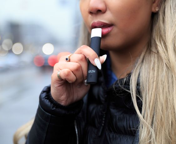 Girl Vaping STLTH Vape